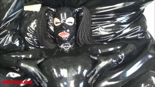 Latex doll gets two orgasms on rubber bed